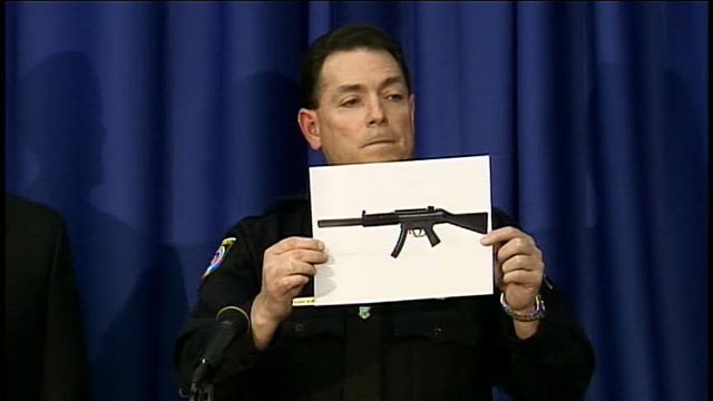 PHOTO: A police officer shows a picture of a gun similar to the one found in a University of Central Florida dorm room, March 18, 2013.