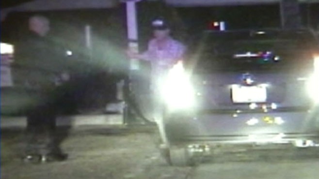 VIDEO: A suspected drunk driver loses control of his car during police stop.