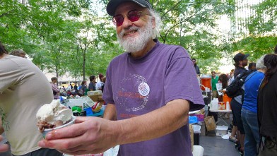 PHOTO: Jeff Furman,Ben & Jerry's Chairman speaks to Abcnews.com at "Occupy Wall Street", as he scoops free ice cream,  Zuccotti Park, New York, NY, Oct. 11, 2011.