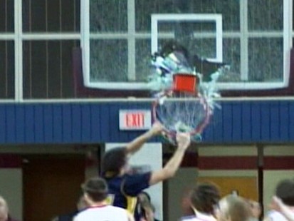 VIDEO: A 15-year-old basketball player causes glass to fly with his slam dunk.