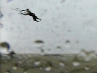 Picture of windboarder being dragged by the wind. 