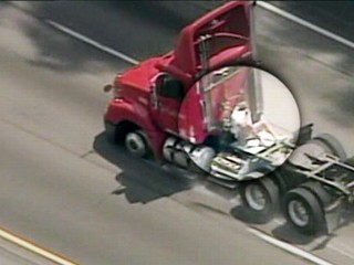 Trucker Hangs On For Dear Life