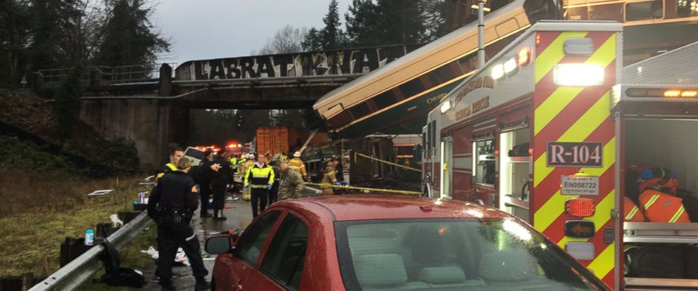 PHOTO: Emergency crews respond to the scene of a train derailment over Interstate 5 in Washington state, Dec. 18, 2017.