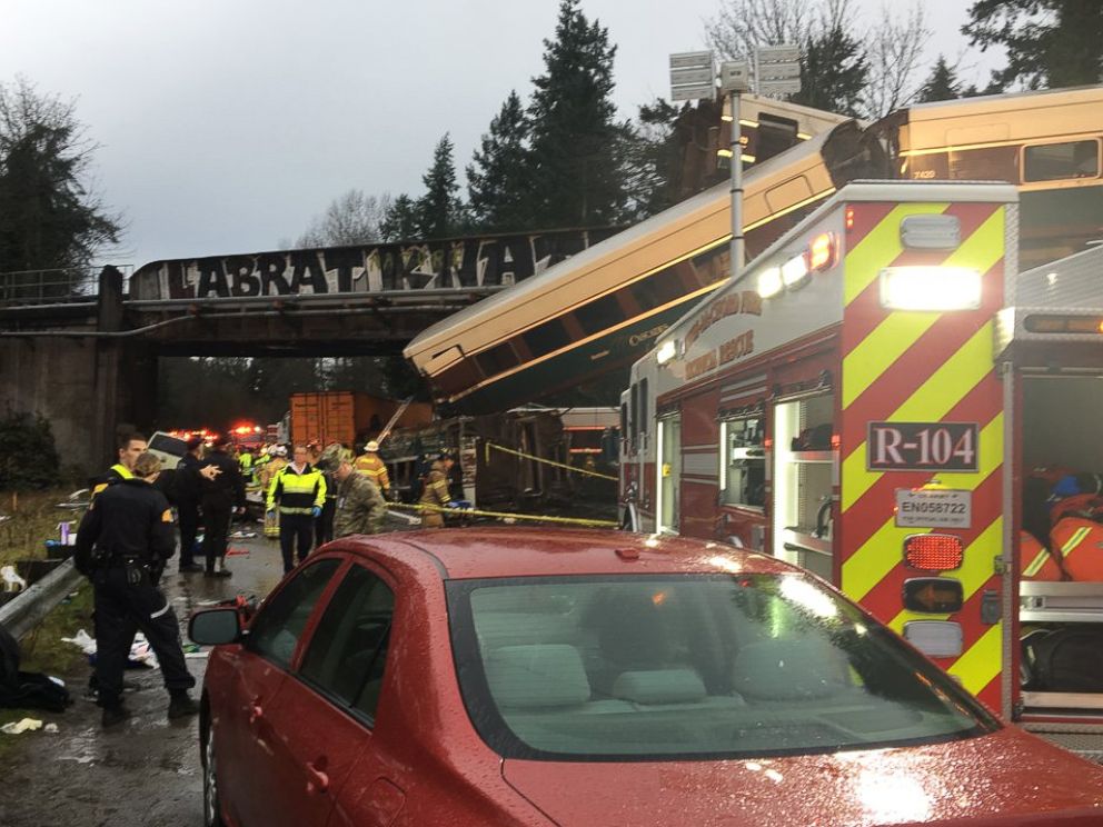 PHOTO: Emergency crews respond to the scene of a train derailment over Interstate 5 in Washington state, Dec. 18, 2017.