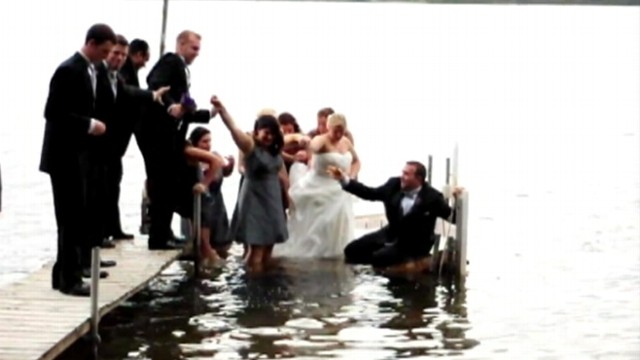 VIDEO: Wedding party fell into Lake Michigan while standing on a dock.