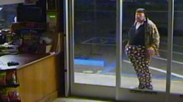 VIDEO: Man walks to door with face uncovered, then trips and falls as he runs away.