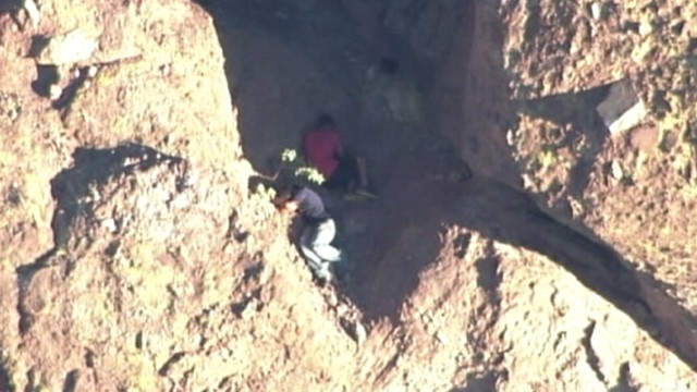 VIDEO: Arizona firefighters rescued two hikers after a third fell 150 feet trying to escape a swarm of bees.