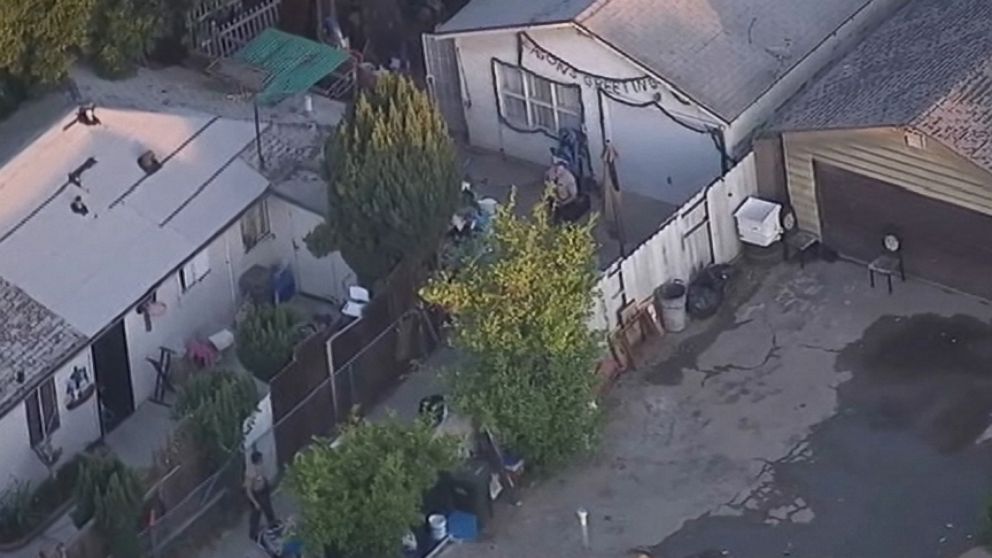 Los Angeles police investigate the stabbing deaths of three young girls at the womans home.