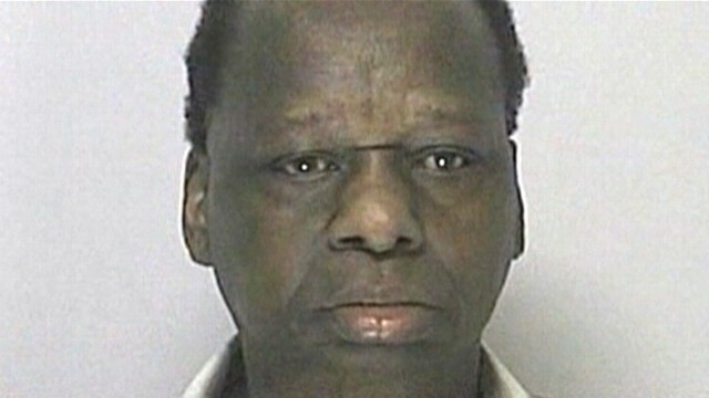 VIDEO: Onyango Obama, 67, was arrested after making a rolling a stop in Massachusetts.