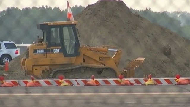 VIDEO: Construction crews discovered the bare bones while digging up a runway in Kansas City.