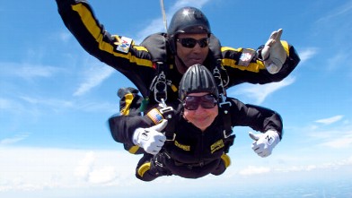 PHOTO: In this, June 23, 2012, photo provided by Sgt. 1st Class Marc Owens, 83-year-old Marjorie Bryan makes a tandem jump with retired Sgt. 1st Class Michael Elliott at the Allen County Airport in Lima, Ohio.