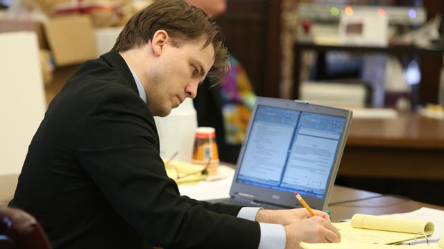 PHOTO: Brett T. Seacat writes on a note pad during the the State v. Brett T. Seacat trial, Kingman, Kan. May 31, 2013.