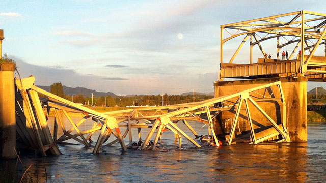 PHOTO: A portion of the Interstate 5 bridge is submerged after it collapsed into the Skagit River dumping vehicles and people into the water in Mount Vernon, Wash., Thursday, May 23, 2013.