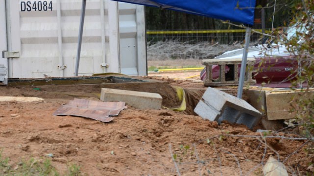 PHOTO: In this undated photo released by the FBI on Tuesday, Feb. 5, 2013, a tent covers the bunker where where a 5-year-old child was held for a week by Jimmy Lee Dykes in Midland City, Ala.