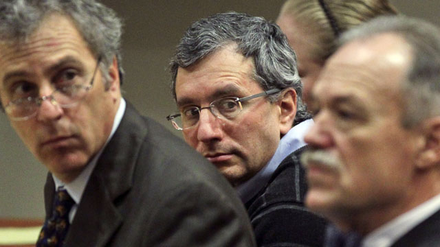 PHOTO: Defendant, Hemy Neuman, center, sits between his defense lawyers, Bob Rubin, left, and Doug Peters during his trial, Feb. 24, 2012 at the DeKalb County Courthouse of DeKalb County Superior Court Judge Gregory Adams in Decatur, Ga.