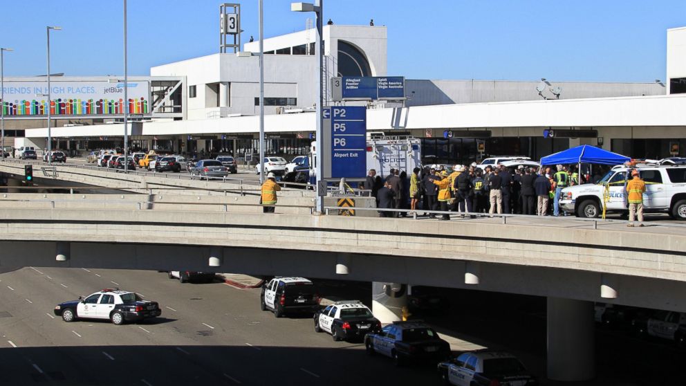 PHOTO: Police, emergency response vehicles and officials are positioned outside Terminal 3 at Los Angeles International Airport on Nov. 1, 2013 where shots were fired, prompting authorities to evacuate a terminal and stop flights.