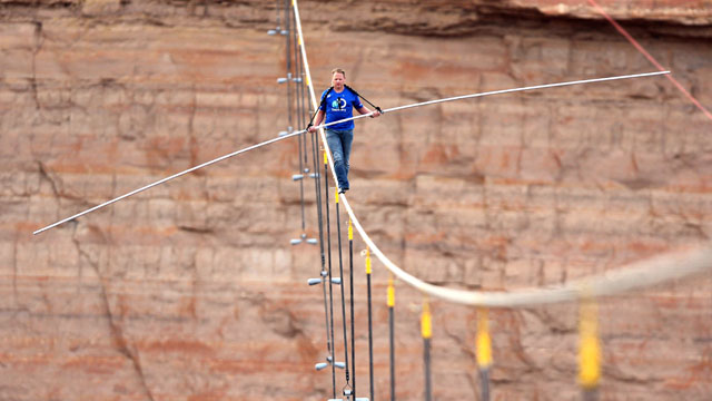 PHOTO: In this photo provided by the Discovery Channel, aerialist Nik Wallenda walks a 2-inch-thick steel cable taking him a quarter mile over the Little Colorado River Gorge, Ariz. on Sunday, June 23, 2013.