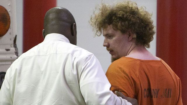 PHOTO: Dylan Quick, who is a suspect in the multiple stabbings on the Lone Star Cy-Fair Campus, right, is escorted by Harris County Sherrifs Office investigators after being questioned, Tuesday, April 9, 2013, in Houston.