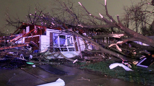 PHOTO: A tree fell on a home on Lynn Haven Lane in Hazelwood, Missouri during a storm that caused extensive damage to homes and businesses on Wednesday, April 10, 2013.