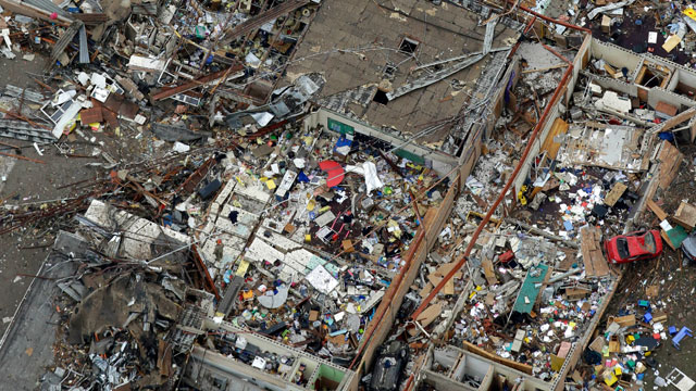 PHOTO: An aerial view shows Briarwood Elementary School with vehicles thrown about after Mondays tornado, May 21, 2013, in Moore, Okla.