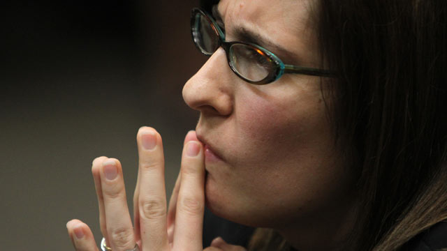 PHOTO: Andrea Sneiderman listens during opening statements by prosecutor Don Geary in Atlanta, Feb. 21, 2012.