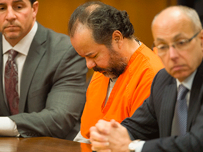 PHOTO: Ariel Castro, center, sits before a judge with his defense attorney's, Craig Weintraub, left, and Jaye Schlachet during a pretrial hearing, June 19, 2013, in Cleveland, Ohio.