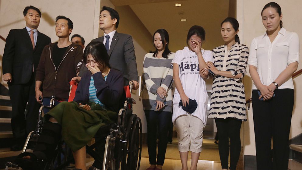 PHOTO: Flight crew members from Asiana Flight 214, which crashed on Saturday, July 6, 2013, appear at a news conference at San Francisco International Airport in San Francisco on July 10, 2013.
