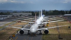 PHOTO: A line of Boeing 787 Dreamliners waiting to be delivered are shown on a closed runway, June 18, 2013 at Paine Field near Boeing's Everett, Wash. assembly plant.