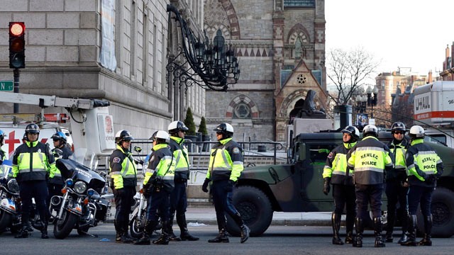 PHOTO: Boston police officers keep a perimeter secure in Bostons Copley Square, April 16, 2013 as an investigation continues into the bomb blasts at the finish area of the Boston Marathon.