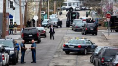 PHOTO: Police presence grows in the neighborhoods of Watertown, Mass., April 19, 2013, as a massive search involving hundreds of heavily armed law enforcement officials continues for one of two suspects in the Boston Marathon bombing.