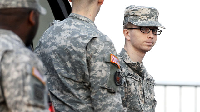 PHOTO: Army Pfc. Bradley Manning, right, is escorted from a security vehicle to a courthouse in Fort Meade, Md., Dec. 22, 2011.