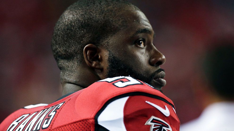 PHOTO: Atlanta Falcons linebacker Brian Banks sits on the bench during the second half of a preseason NFL football game against the Jacksonville Jaguars in Atlanta, Aug. 29, 2013.