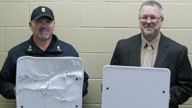 PHOTO: Cold Spring Police Chief Phil Jones, left, and Rocori School District Superintendent Scott Staska pose with bulletproof white boards in Cold Spring, Minn., APril 22, 2013.