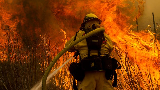 PHOTO: A firefighter battles the wildfire near the farmland along a hillside in Point Mugu , Calif. Friday, May 3, 2013.