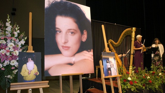 PHOTO: In this May 28, 2002 file photo, photographs of Chandra Levy are on display as musicians, right, stand by at the memorial service for Levy at the Modesto Centre Plaza in Modesto, Calif.