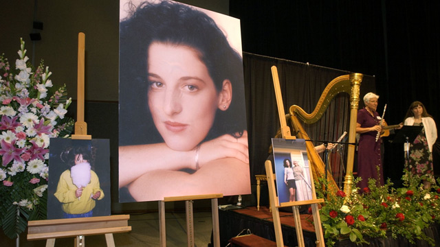 PHOTO: In this May 28, 2002 file photo, photographs of Chandra Levy are on display as musicians, right, stand by at the memorial service for Levy at the Modesto Centre Plaza in Modesto, Calif.
