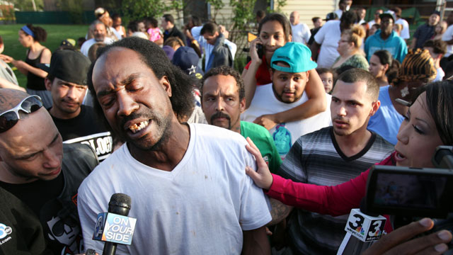 PHOTO: Neighbor Charles Ramsey speaks to media near the home on the 2200 block of Seymour Avenue, where three missing women, Amanda Berry, Gina DeJesus and Michele Knight, were rescued in Cleveland, on May 6, 2013.