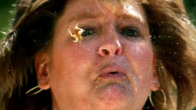 PHOTO: 8-16-2006 Jenny Franklin of Otterbein, Ind. puts in her best effort while spitting out a cricket during the Cricket Spitting Contest at the Indiana State Fair, Aug. 16, 2006, in Indianapolis.