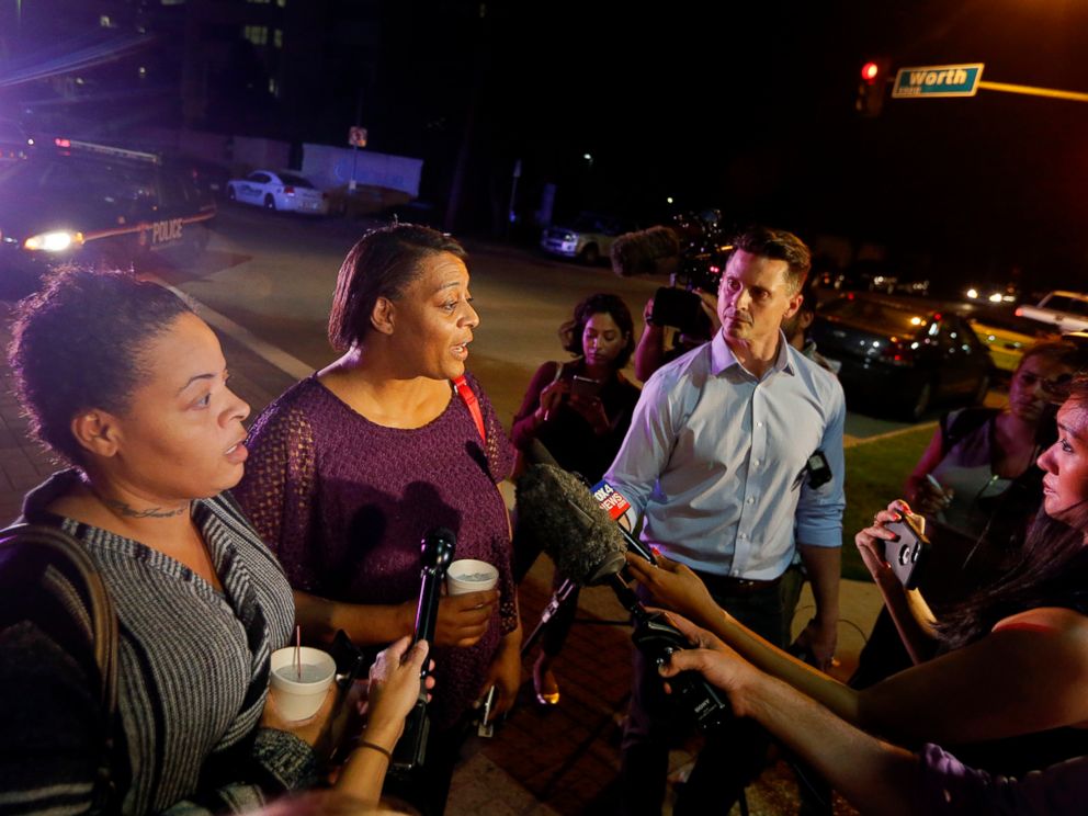 PHOTO: Sherie Williams, left, and Theresa Williams, center, speak to reporters outside Baylor University Medical Center, Friday, July 8, 2016, in Dallas, Texas. Theresa Williams said her sister Shetamia Taylor, was shot in the leg.