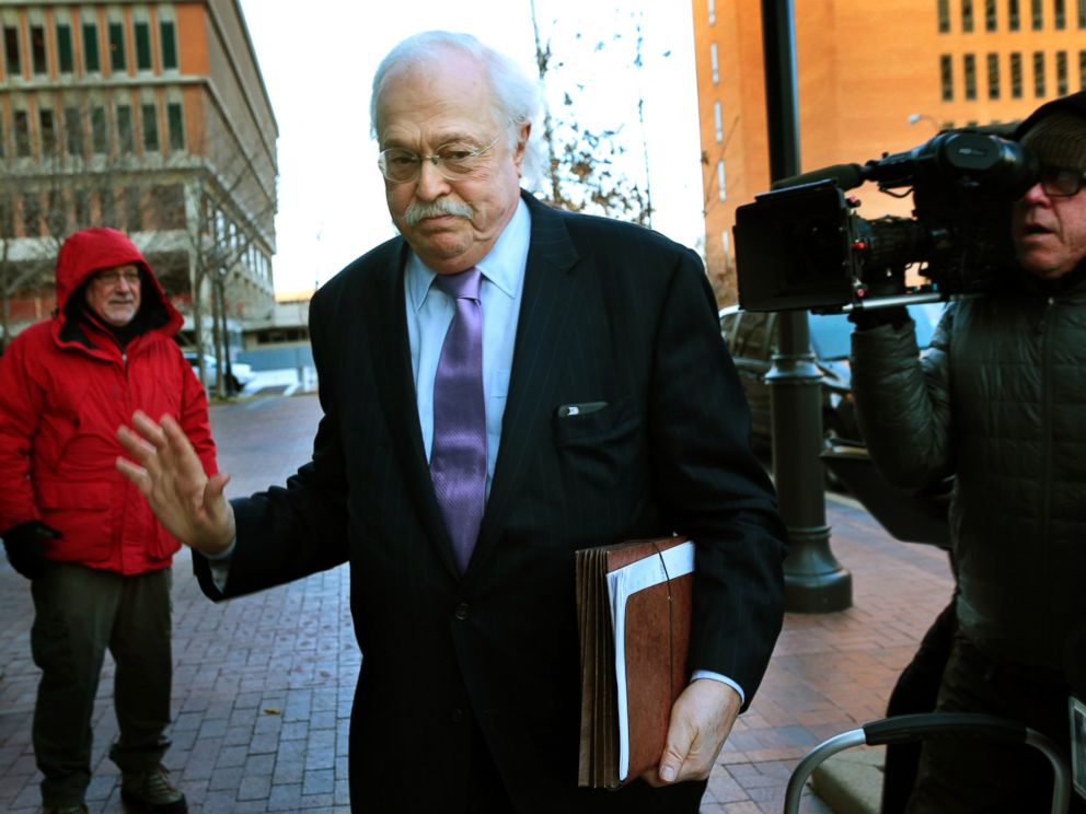 PHOTO: Pathologist Dr. Michael Baden waves off media questions as he arrives to testify before the grand jury concerning the Michael Brown shooting at the Buzz Westfall Justice Center in Clayton, Mo., on Nov. 13, 2014.