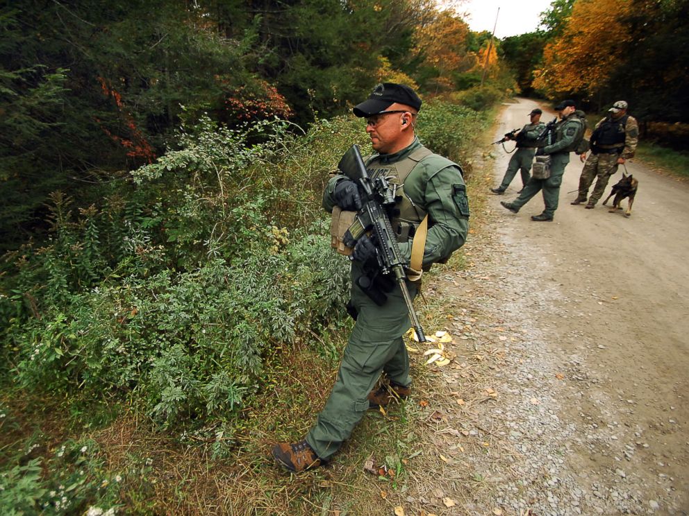 PHOTO: A member of the Scranton, Pa., Police Special Operations Group, prepares to ender the woods, Oct. 2, 2014, in Barrett Township, Pa., to search for suspected killer Eric Frein.