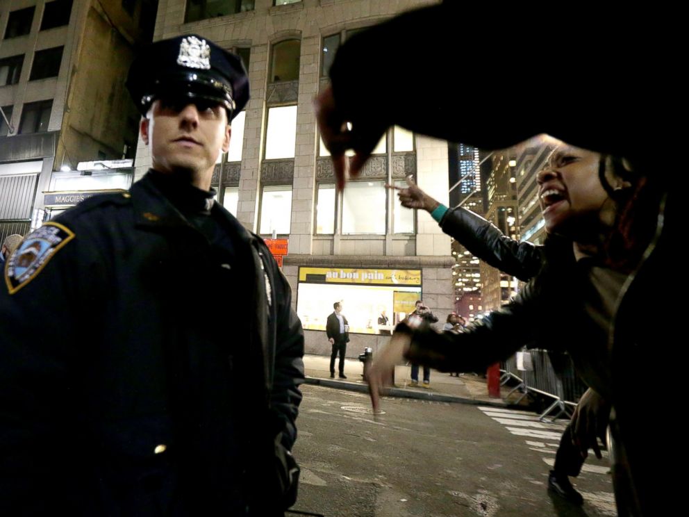 PHOTO: A woman yells at a New York City Police officer during a protest after it was announced that the officer involved in the death of Eric Garner is not being indicted, Dec. 3, 2014, in New York.