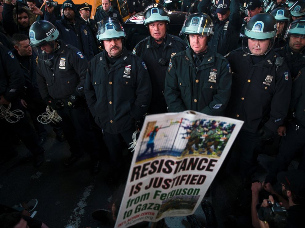 PHOTO: Police block demonstrators as they attempt to make their way through Times Square in protest against a grand jurys decision on Monday not to indict Ferguson police officer Darren Wilson in the shooting of Michael Brown, Nov. 25, 2014, in New York.