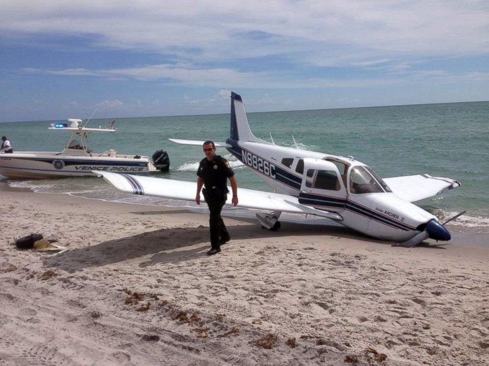 PHOTO: This Sunday, July 27, 2014, photo provided by the Sarasota County Sheriffs Office shows emergency personnel at the scene of a small plane crash in Caspersen Beach in Venice, Fla.