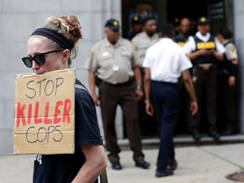 PHOTO: A protester displays a sign outside a courthouse after Officer Caesar Goodson was acquitted of all charges in his trial in Baltimore, June 23, 2016.