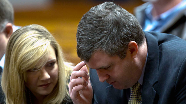 PHOTO: Gabe Watson talks with his wife, Kim, after arriving at the Jefferson County Courthouse in Birmingham, Ala., Feb. 13, 2012, for jury selection in his trial.