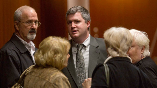 PHOTO: Gabe Watson, center, talks with family members including his father David Watson, left, during a break in his trial at the Mel Bailey Criminal Justice Center in Birmingham, Ala., Feb. 16, 2012.