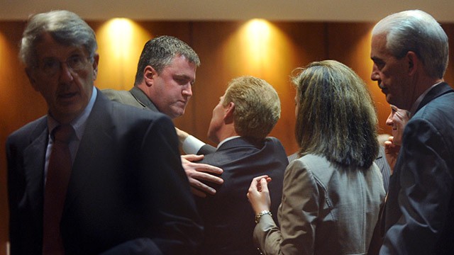 PHOTO: Gabe Watson hugs his defense team