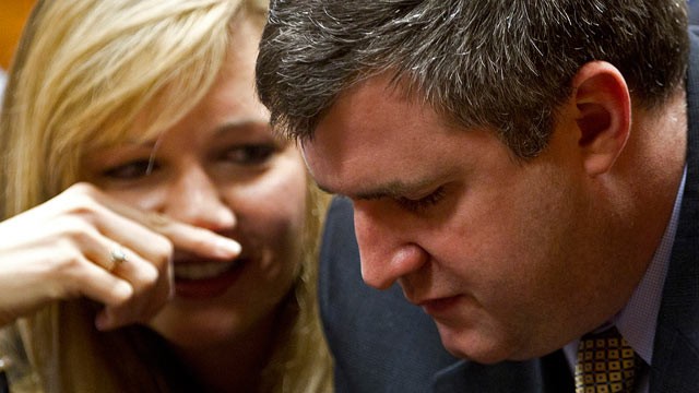 PHOTO: Gabe Watson talks with his wife, Kim, after arriving at the Jefferson County Courthouse in Birmingham, Ala., Feb. 13, 2012, for jury selection in his trial.