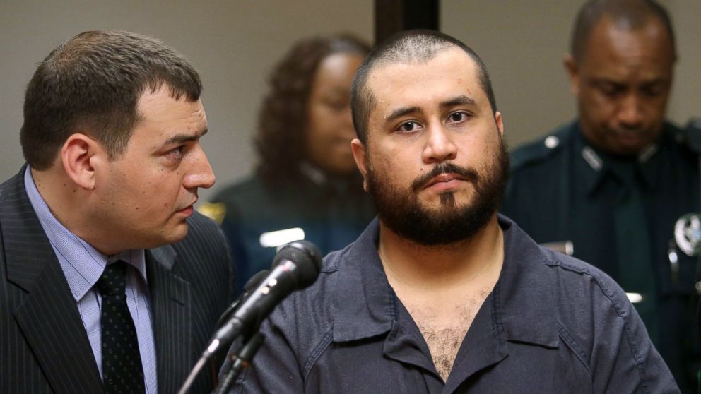 PHOTO: George Zimmerman, acquitted in the high-profile killing of unarmed black teenager Trayvon Martin, listens to defense counsel Daniel Megaro, left, Nov. 19, 2013, in Sanford, Fla.